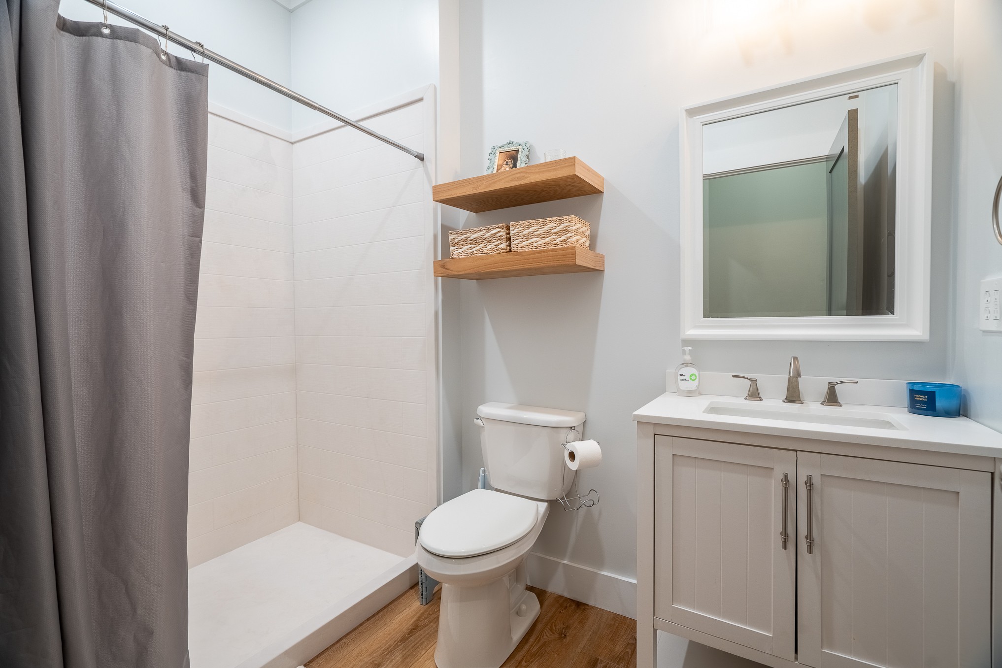 54 Spring Drive Killen, AL 35645 - Photo 67 of 75 a bathroom with a toilet sink vanity and mirror