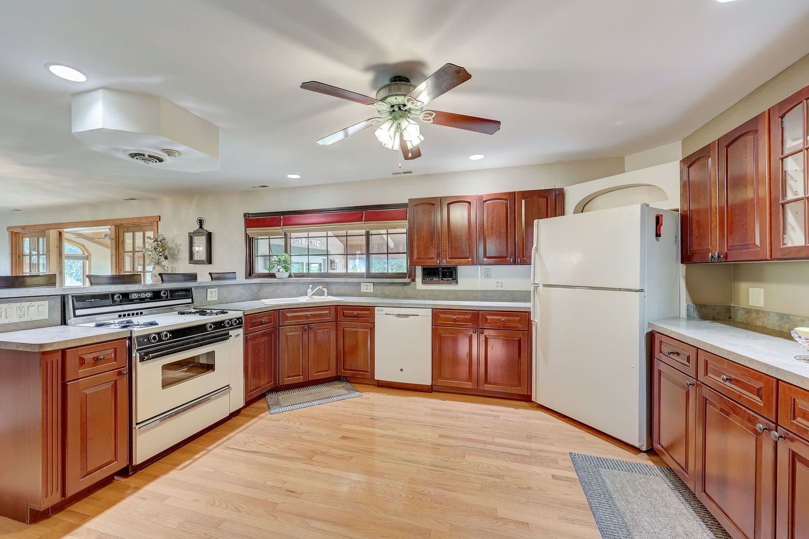 4234 East 12000th Road North Peotone, IL 60468 - Photo 23 of 62 a kitchen with stainless steel appliances granite countertop a stove sink and refrigerator