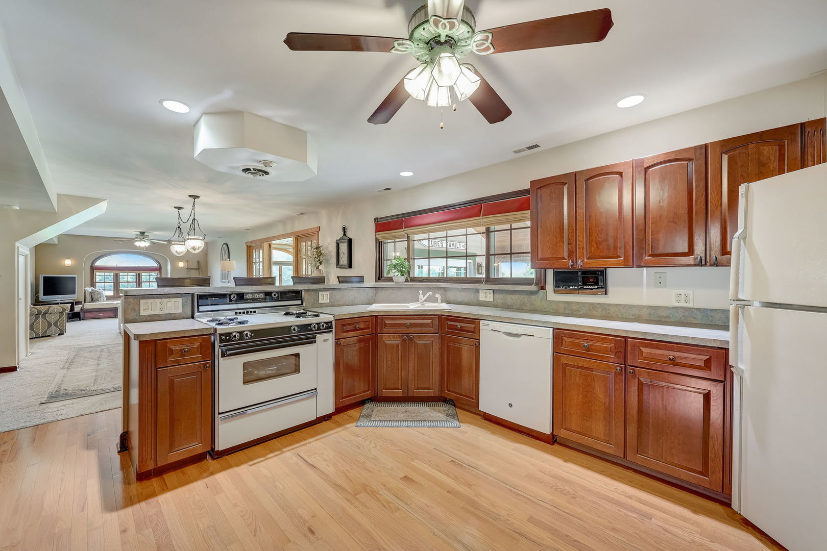 4234 East 12000th Road North Peotone, IL 60468 - Photo 24 of 62 a kitchen with stainless steel appliances granite countertop a stove and cabinets