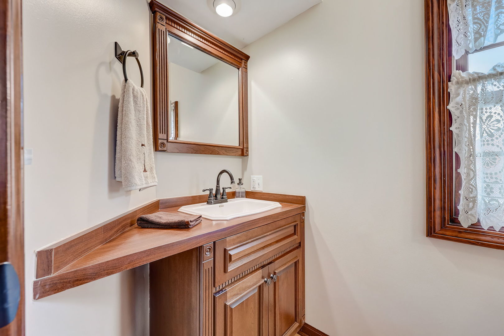 4234 East 12000th Road North Peotone, IL 60468 - Photo 25 of 62 a bathroom with a sink and a mirror