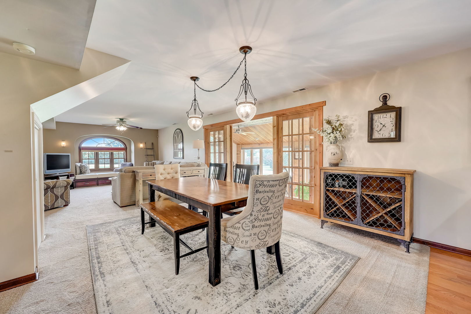 4234 East 12000th Road North Peotone, IL 60468 - Photo 26 of 62 a dining room with furniture a chandelier and wooden floor