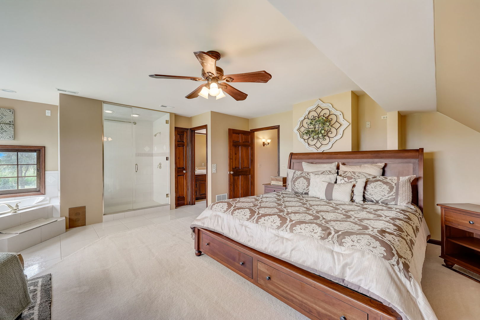 4234 East 12000th Road North Peotone, IL 60468 - Photo 34 of 62 a bedroom with a large bed a chandelier and closet