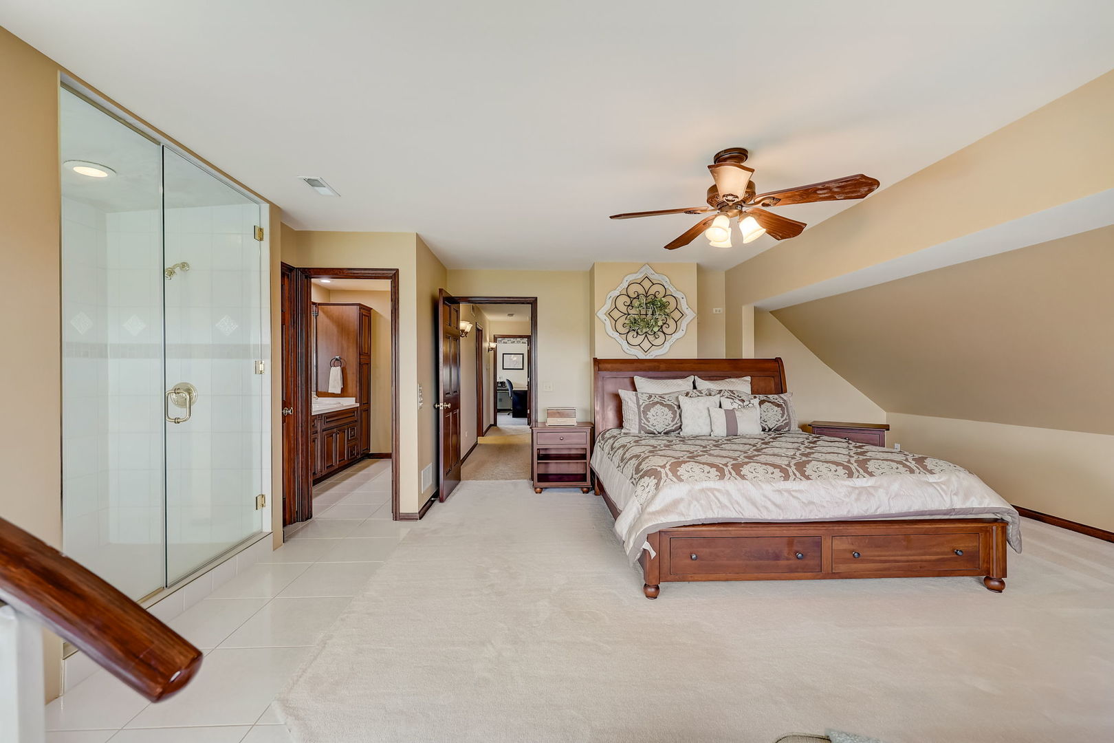 4234 East 12000th Road North Peotone, IL 60468 - Photo 39 of 62 a spacious bedroom with a bed a chandelier and closet