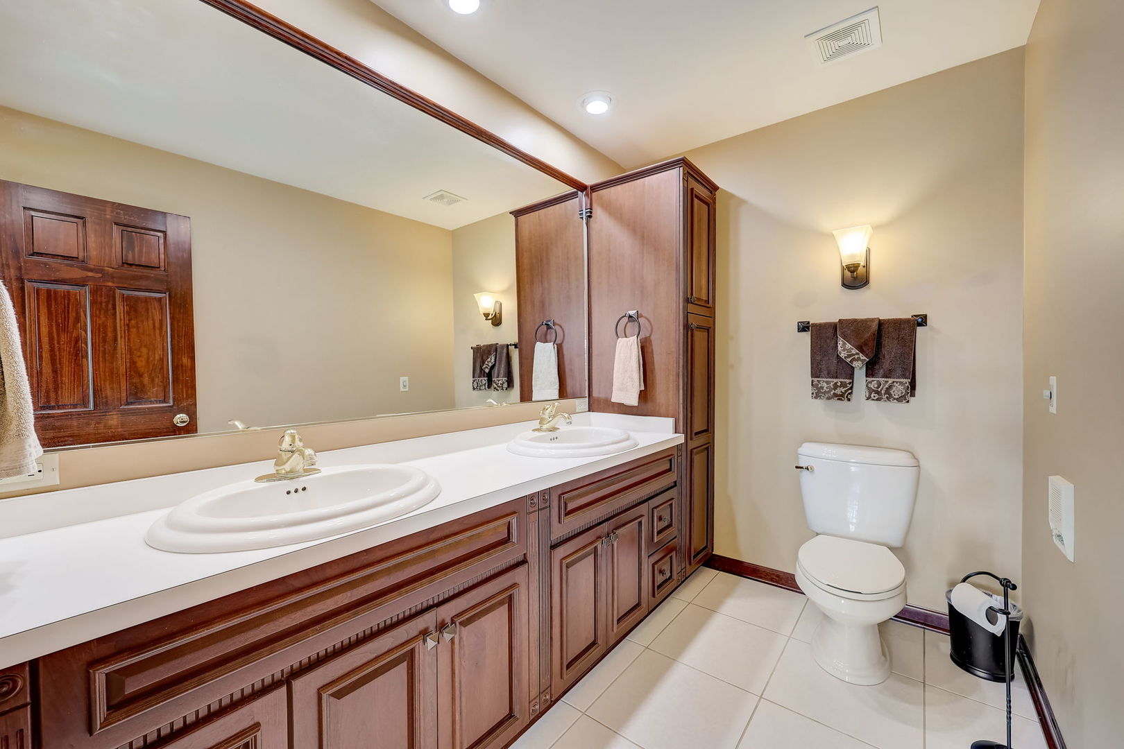 4234 East 12000th Road North Peotone, IL 60468 - Photo 42 of 62 a spacious bathroom with a toilet sink and mirror