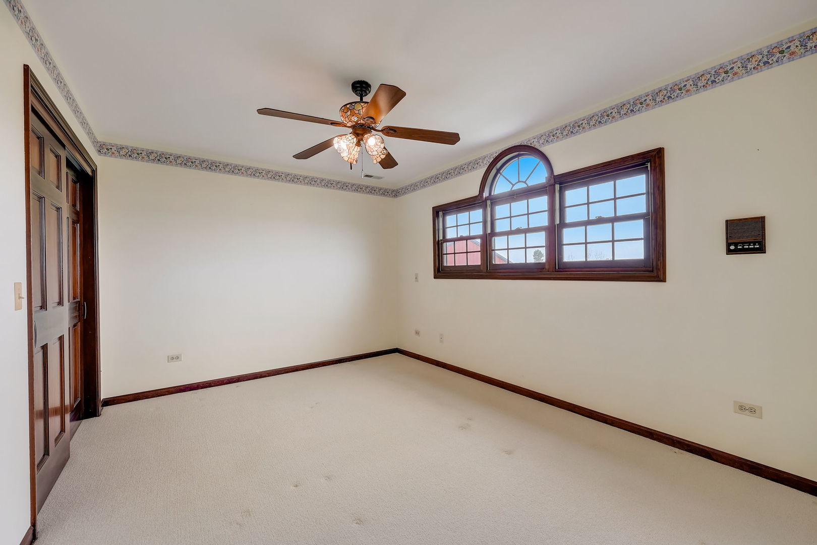 4234 East 12000th Road North Peotone, IL 60468 - Photo 45 of 62 an empty room with windows and fan