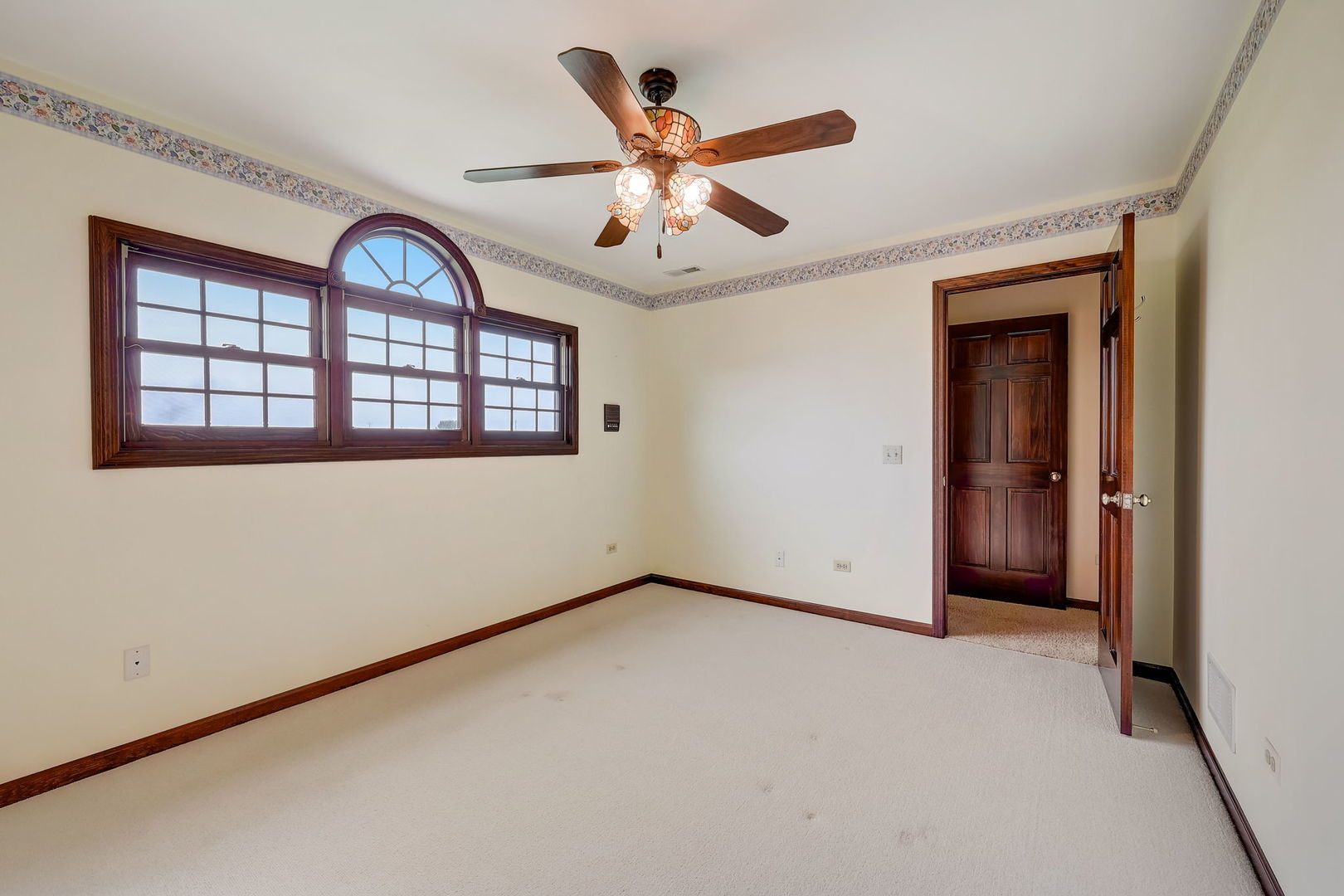 4234 East 12000th Road North Peotone, IL 60468 - Photo 46 of 62 an empty room with ceiling fan and window
