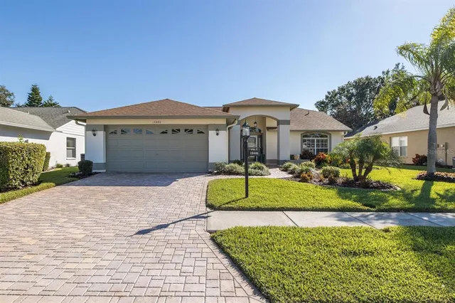 a front view of a house with a yard and porch
