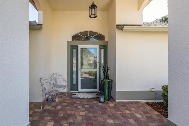 a view of a room with furniture and wooden floor