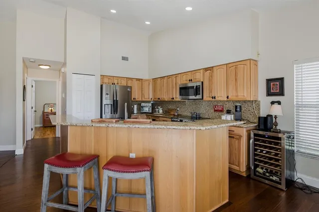 a bedroom with bed and wooden floor