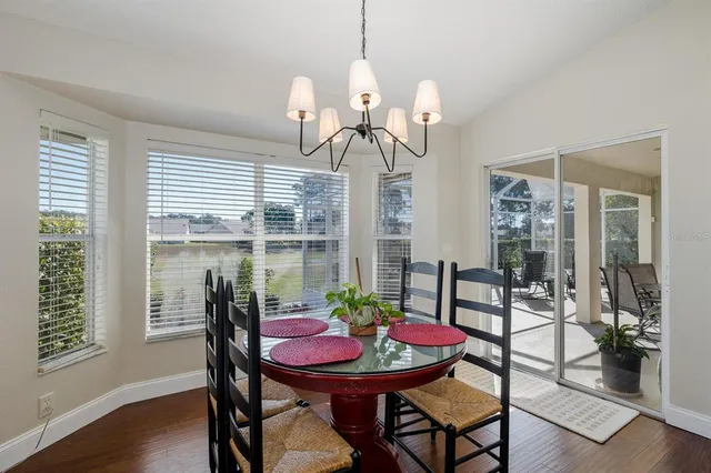 a spacious bathroom with a toilet sink and mirror