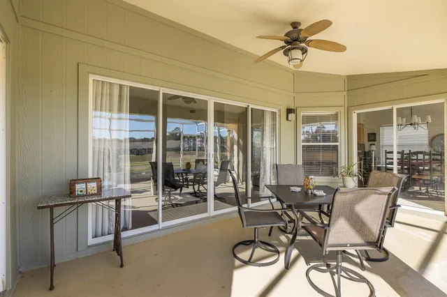 a view of swimming pool with an outdoor space and seating area