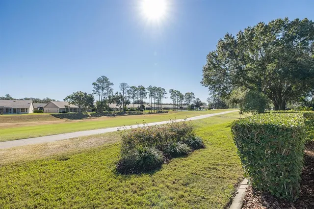 a view of a lake with houses in the background