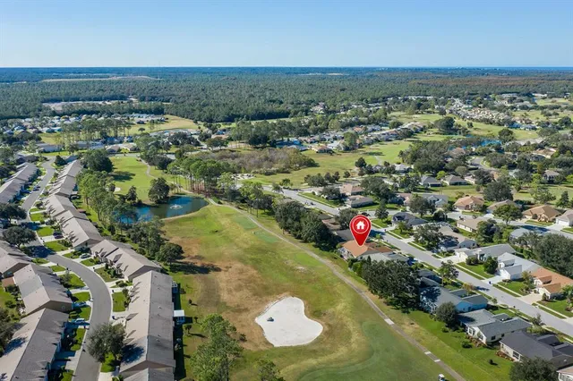 an aerial view of a houses with a lake view