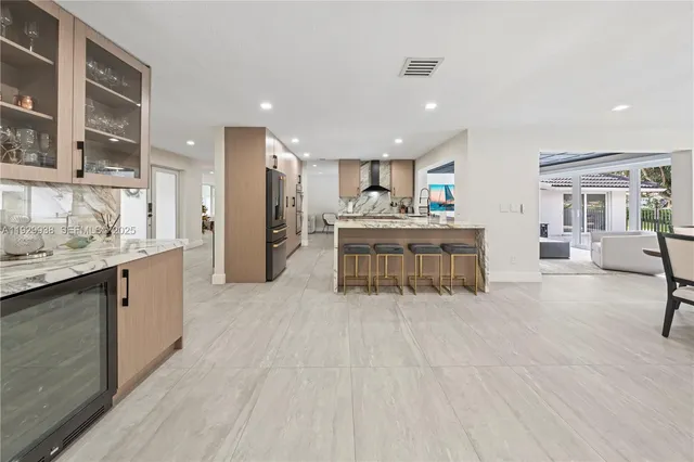 a large white bed in a white room