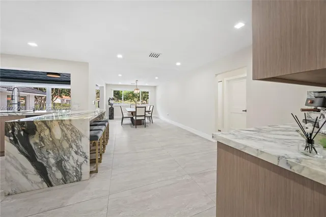 a kitchen with stainless steel appliances granite countertop a sink and a granite counter tops