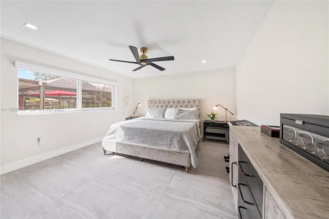 a bedroom with a bed and window