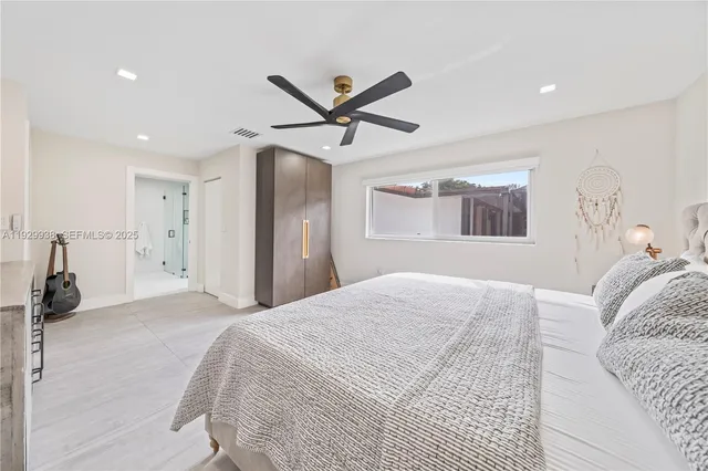 a spacious bathroom with a double vanity sink and a mirror