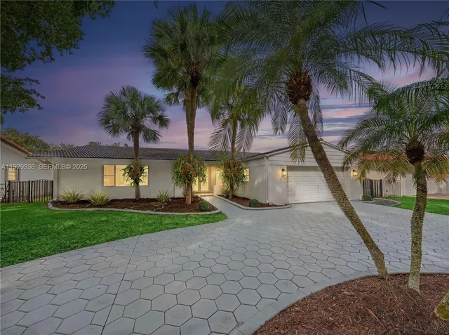 a view of a yard and front view of a house