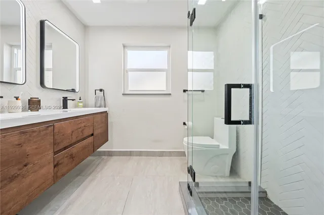 a bed room with a bed and a chair