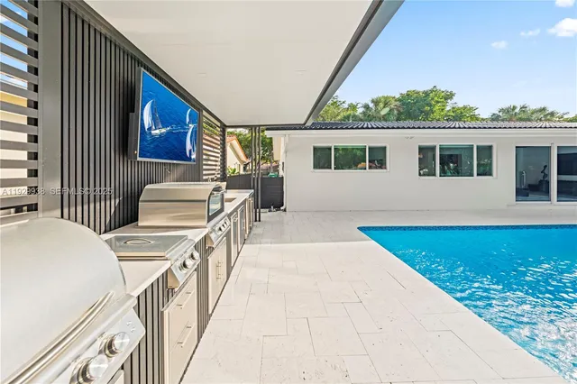 an aerial view of a houses with a lake