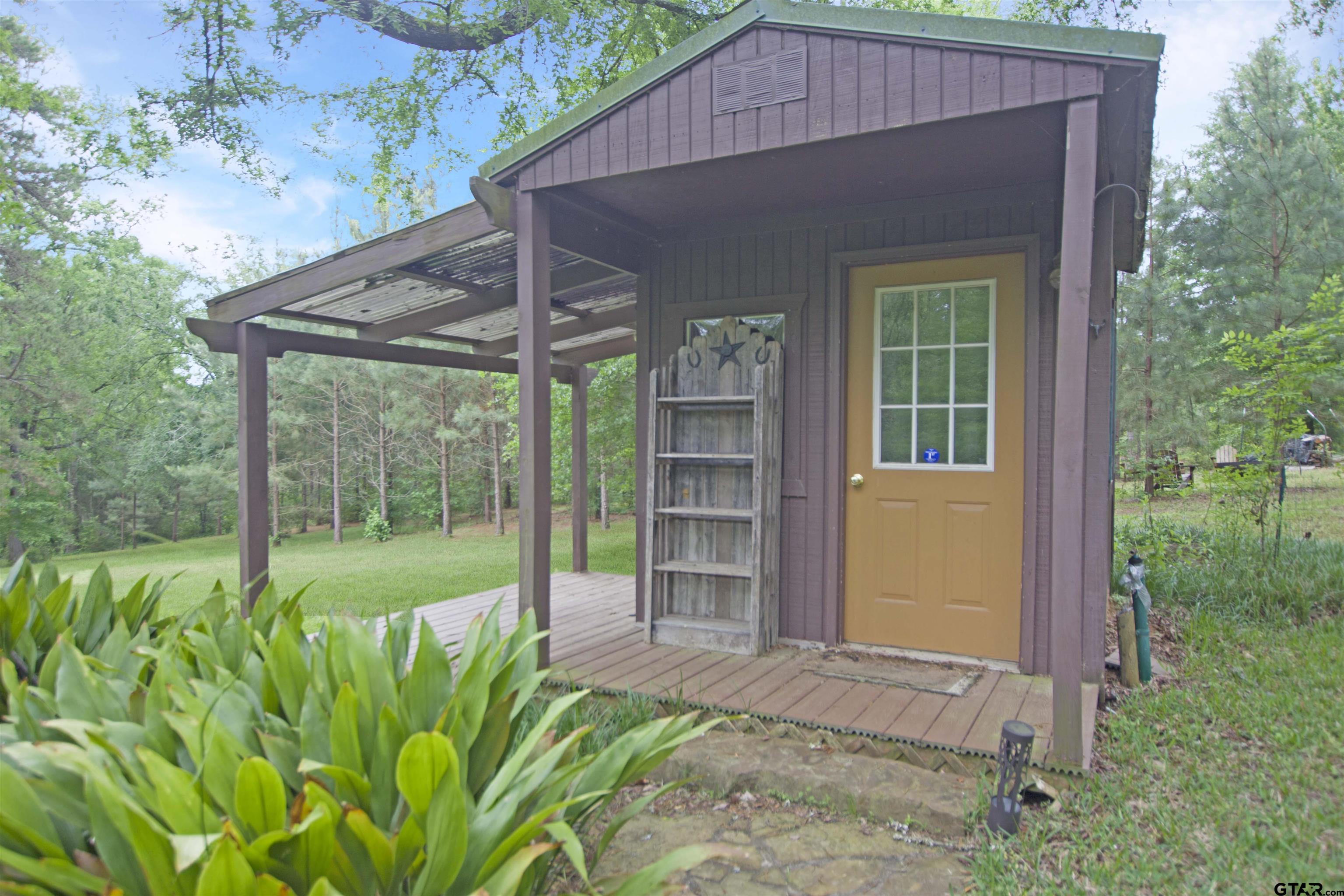 782 Rosie Wady Road Gladewater, TX 75647 - Photo 43 of 48 a house view with a backyard space