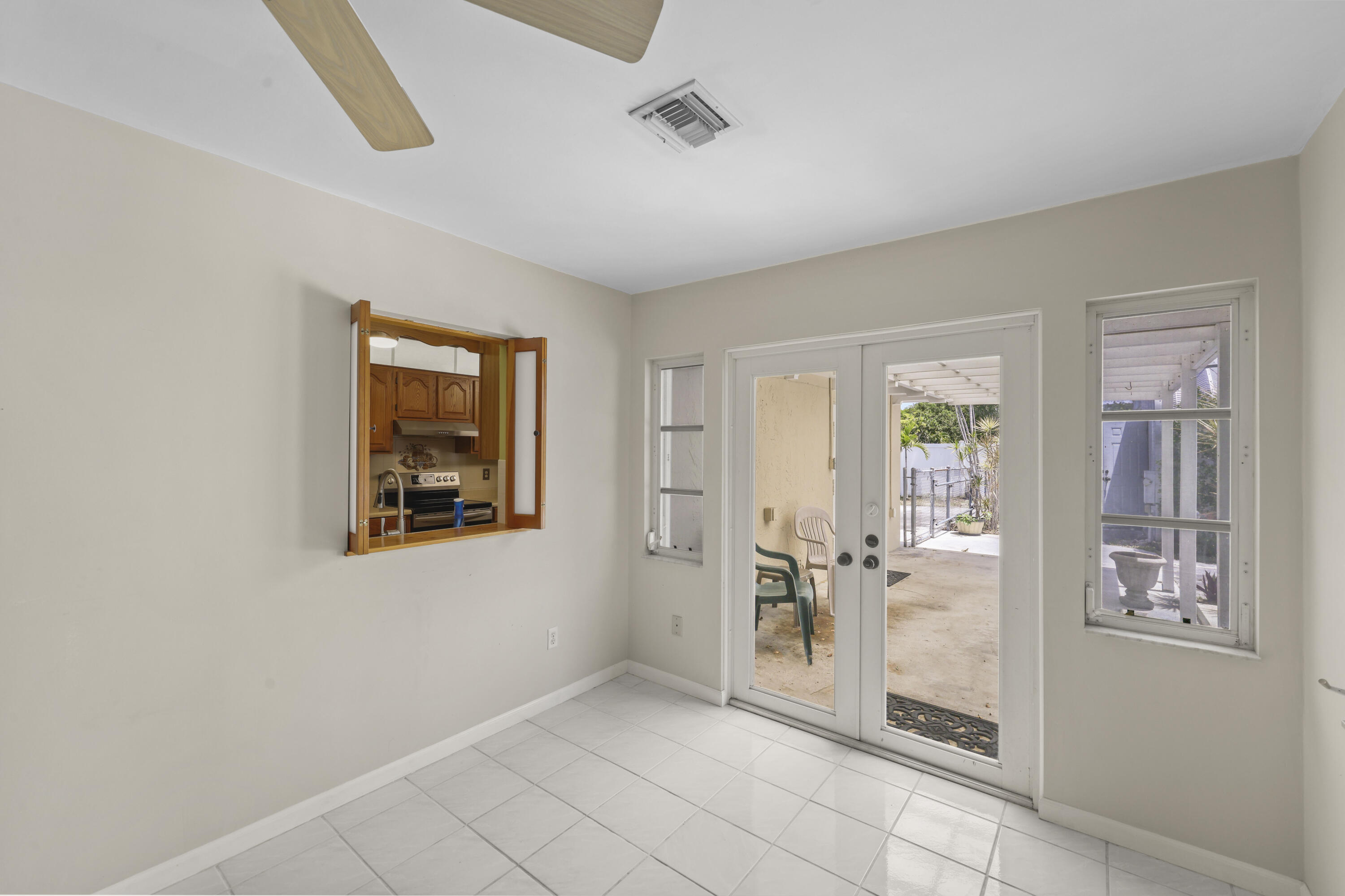 1720 Southwest 10th Street Boca Raton, FL 33486 - Photo 27 of 57 a view of a hallway to rooms and dining room