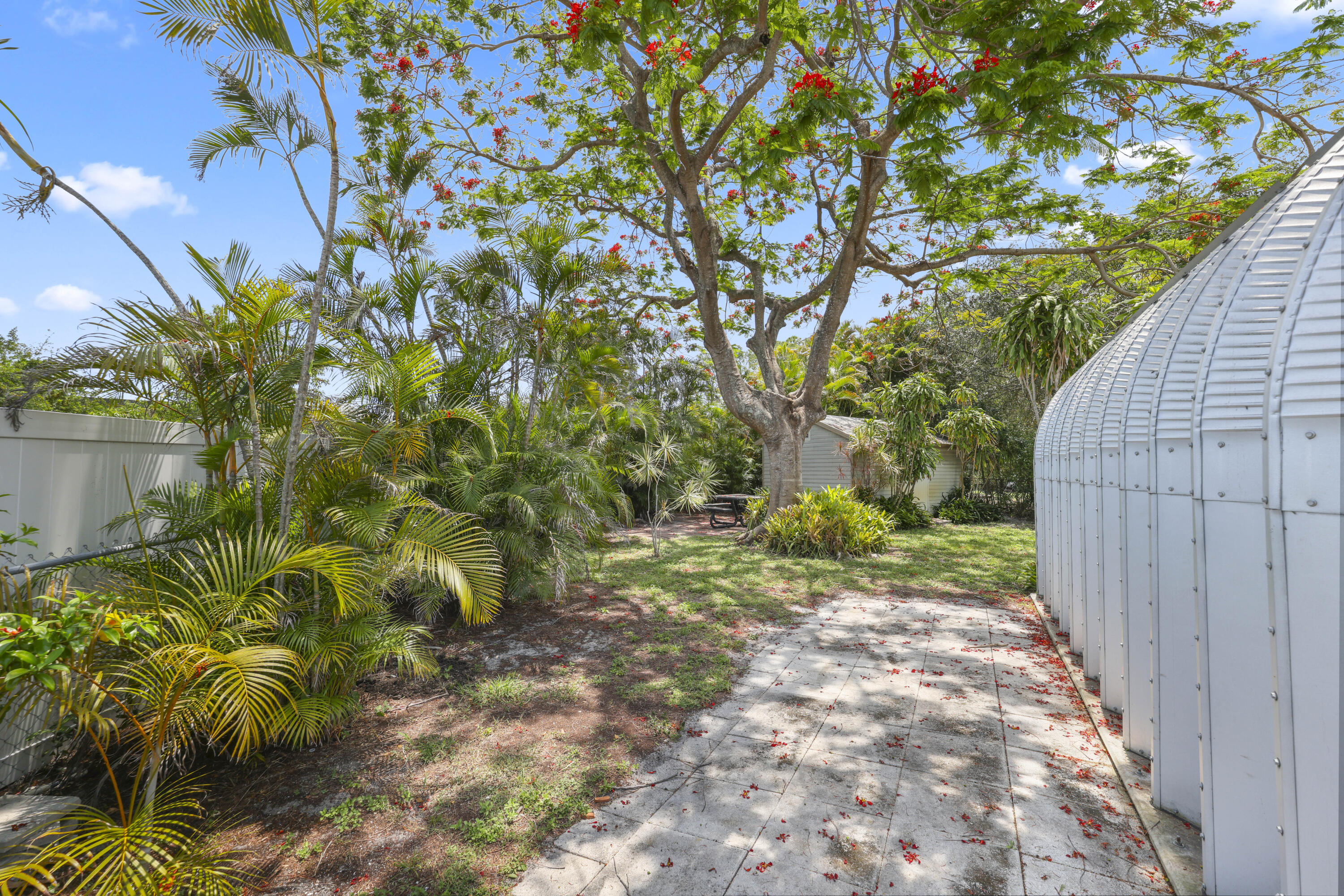 1720 Southwest 10th Street Boca Raton, FL 33486 - Photo 48 of 57 a backyard of a house with lots of green space