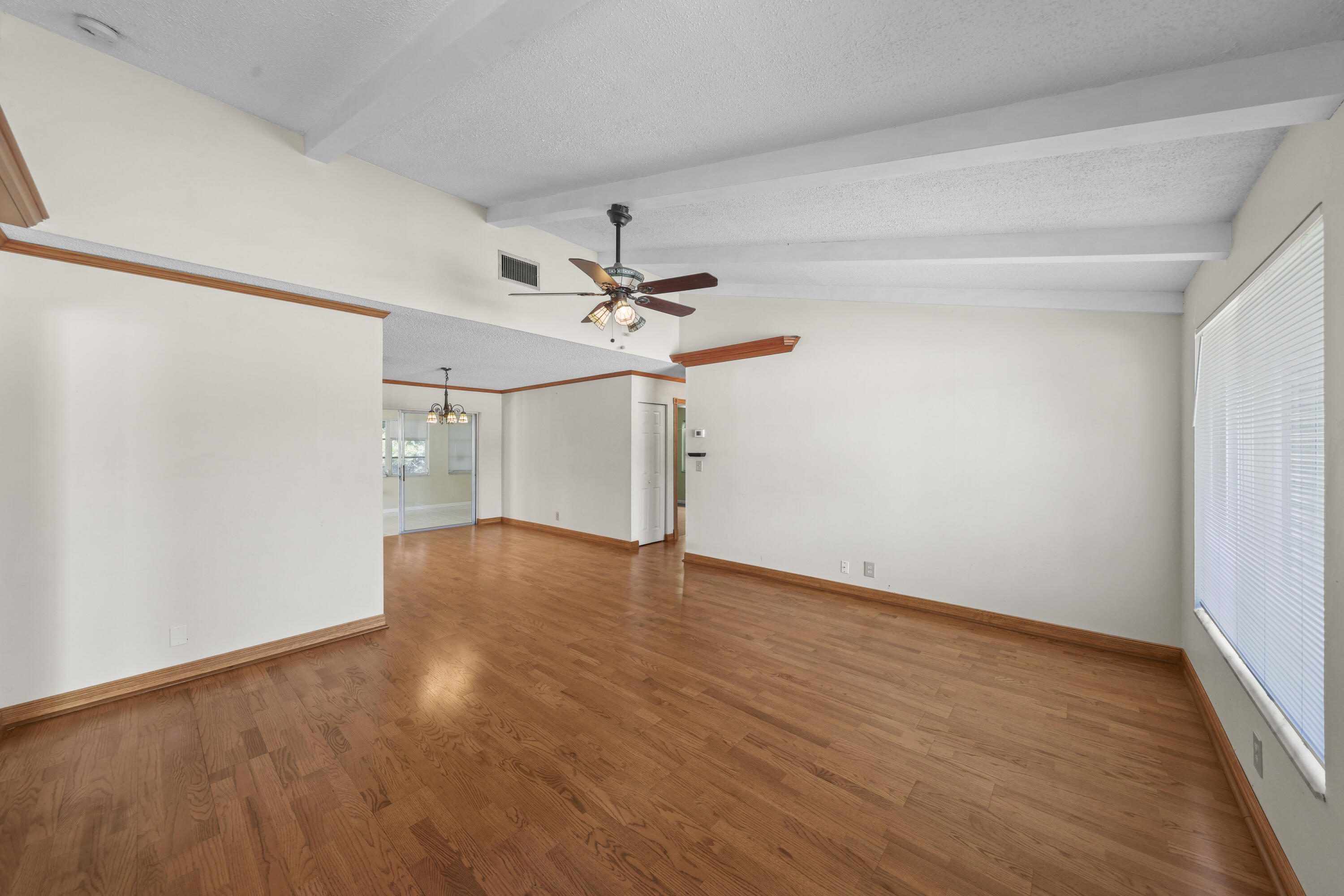 1720 Southwest 10th Street Boca Raton, FL 33486 - Photo 6 of 57 wooden floor in an empty room