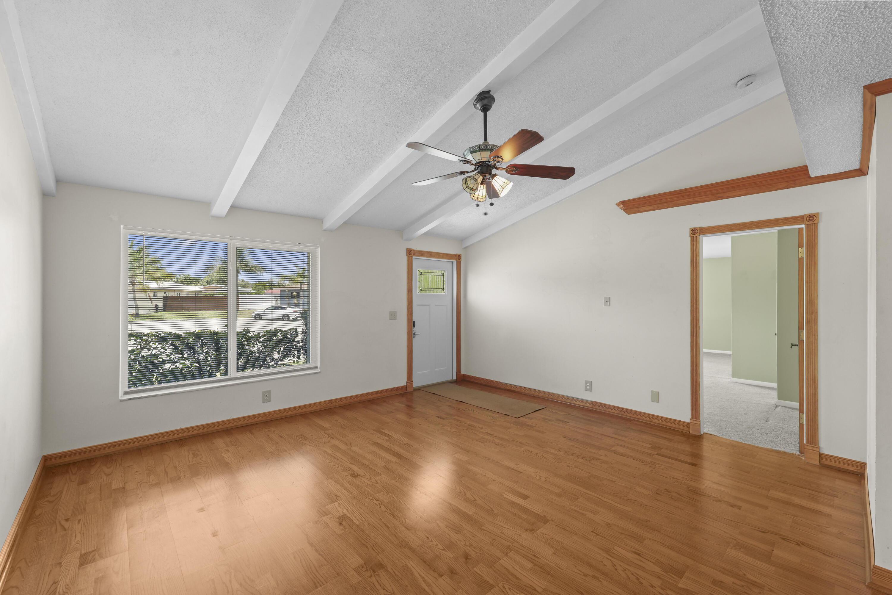 1720 Southwest 10th Street Boca Raton, FL 33486 - Photo 7 of 57 a view of an empty room with a window