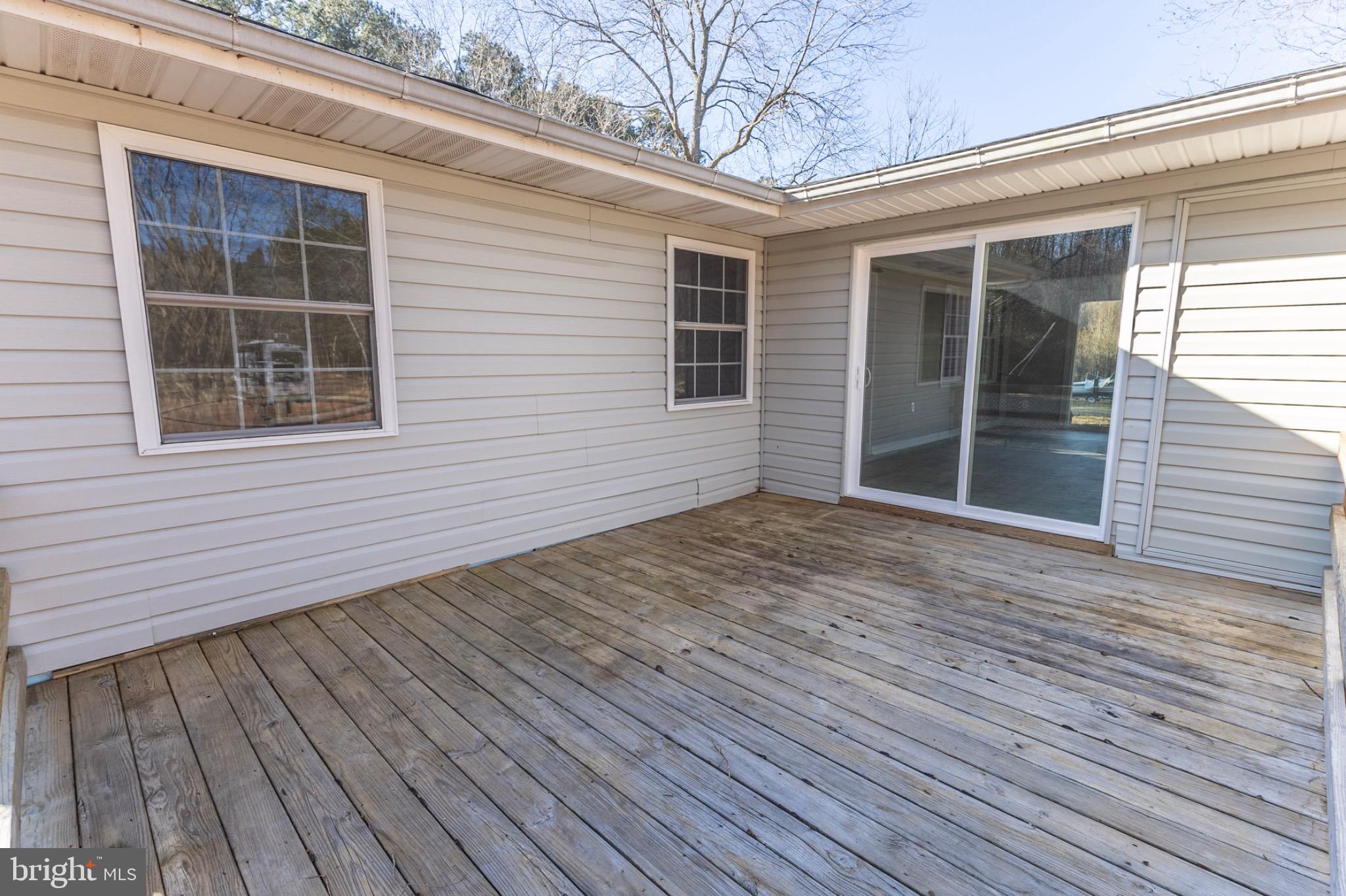 49151 Wynne Road Ridge, MD 20680 - Photo 72 of 80 Spacious deck for outdoor relaxation.