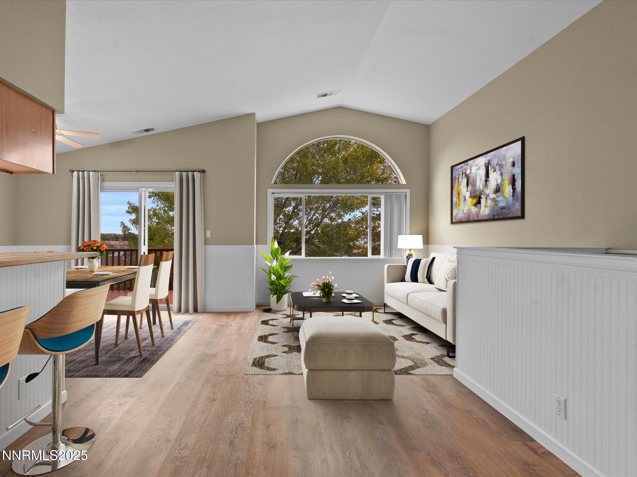 732 Talus Way Reno, NV 89503 - Photo 5 of 50 a living room with furniture a large window and wooden floor