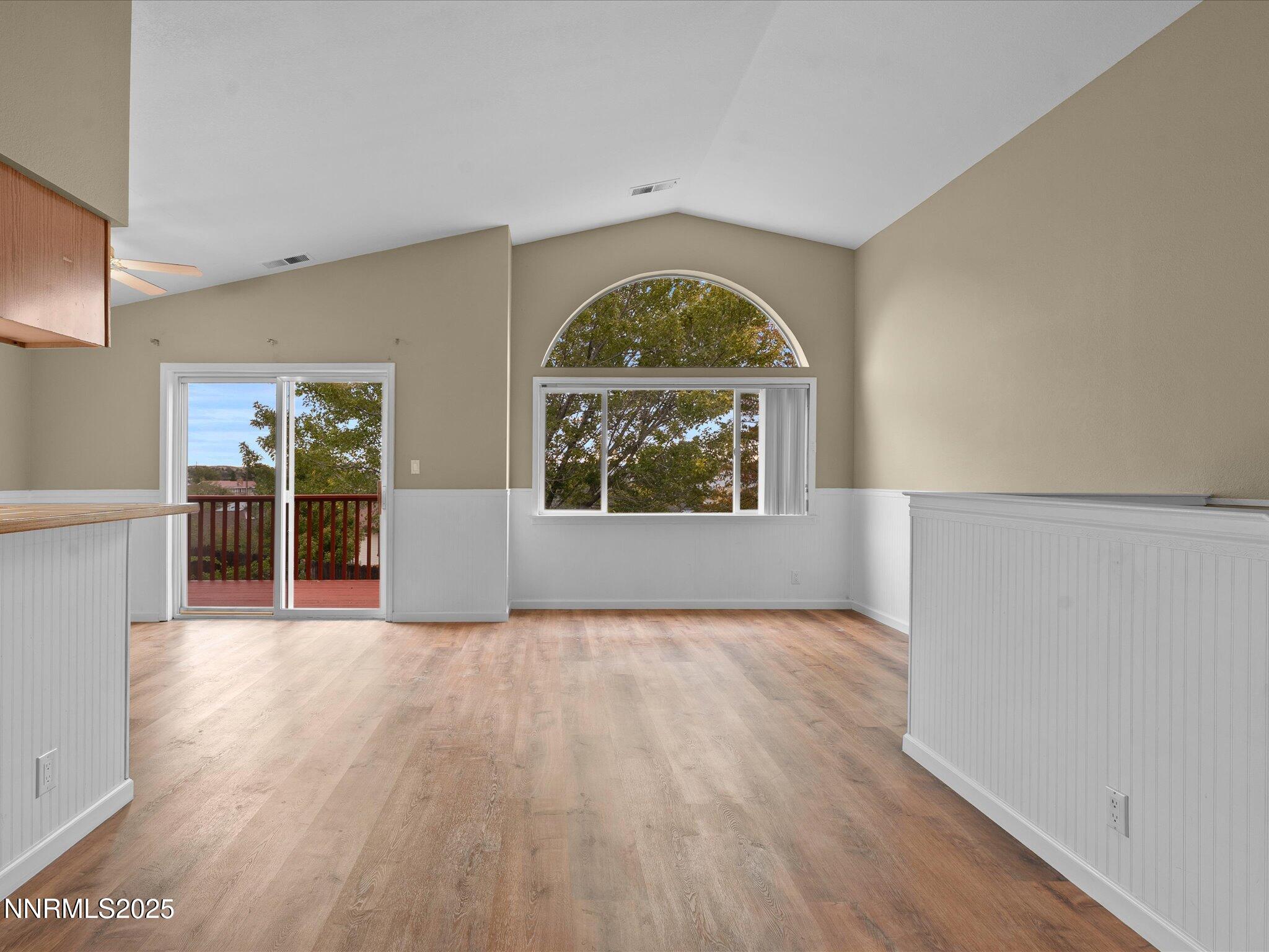 732 Talus Way Reno, NV 89503 - Photo 6 of 50 a view of an empty room with a window and wooden floor