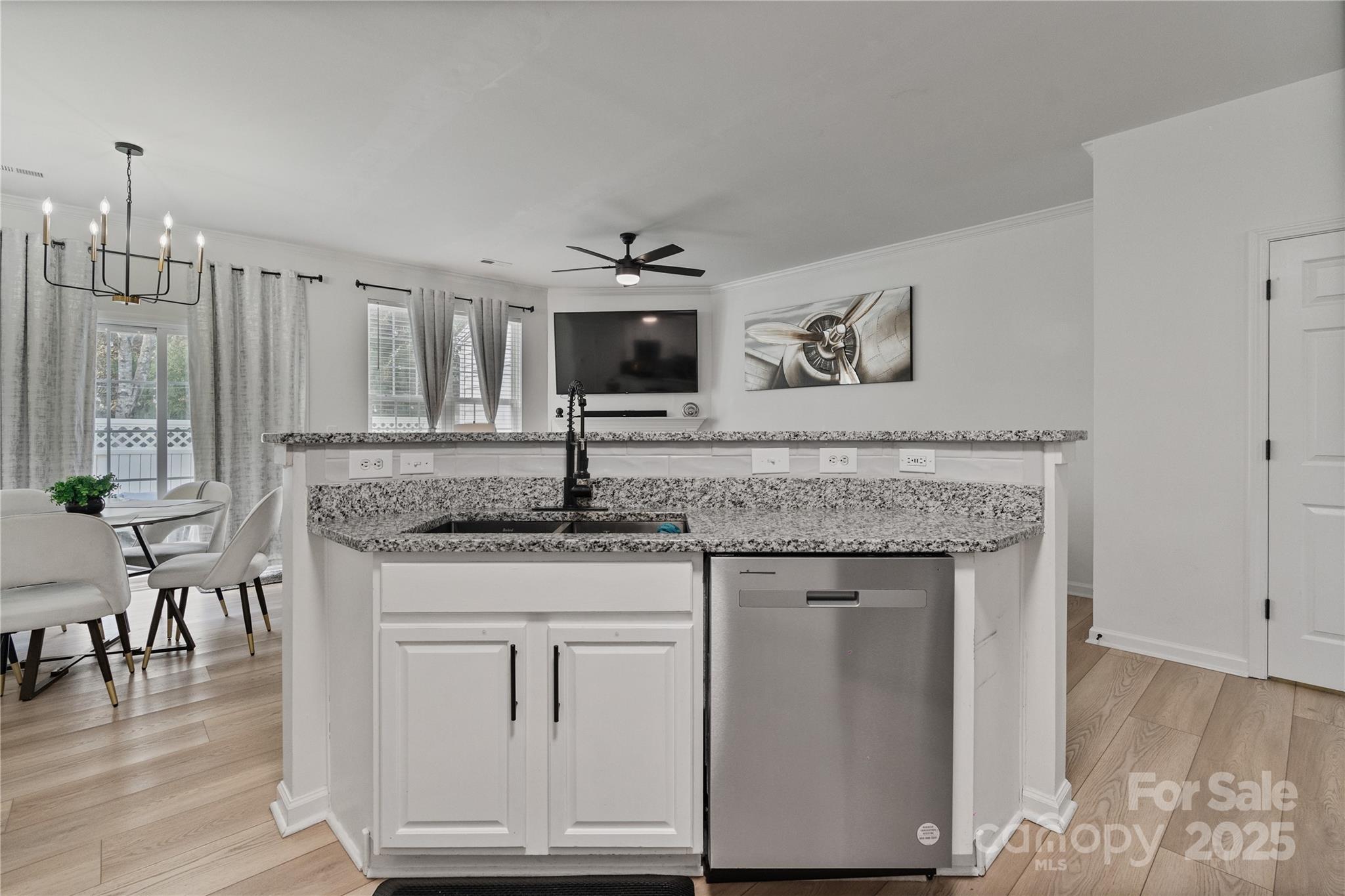 706 Shellstone Place Fort Mill, SC 29708 - Photo 11 of 23 a kitchen with granite countertop a sink cabinets and wooden floor