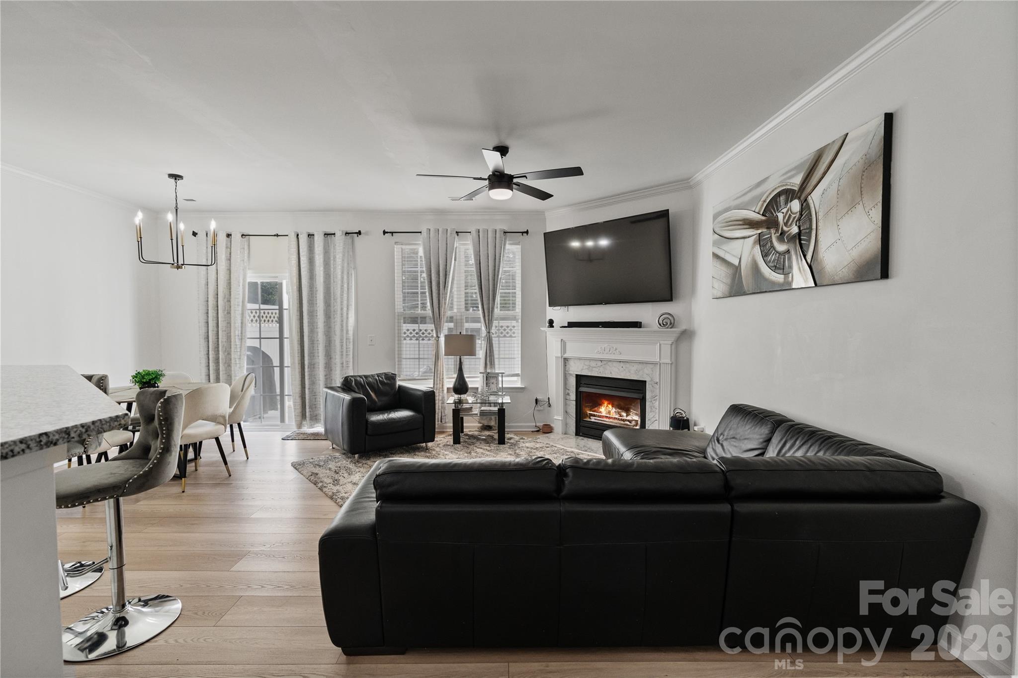 706 Shellstone Place Fort Mill, SC 29708 - Photo 13 of 23 a living room with furniture a fireplace and a flat screen tv