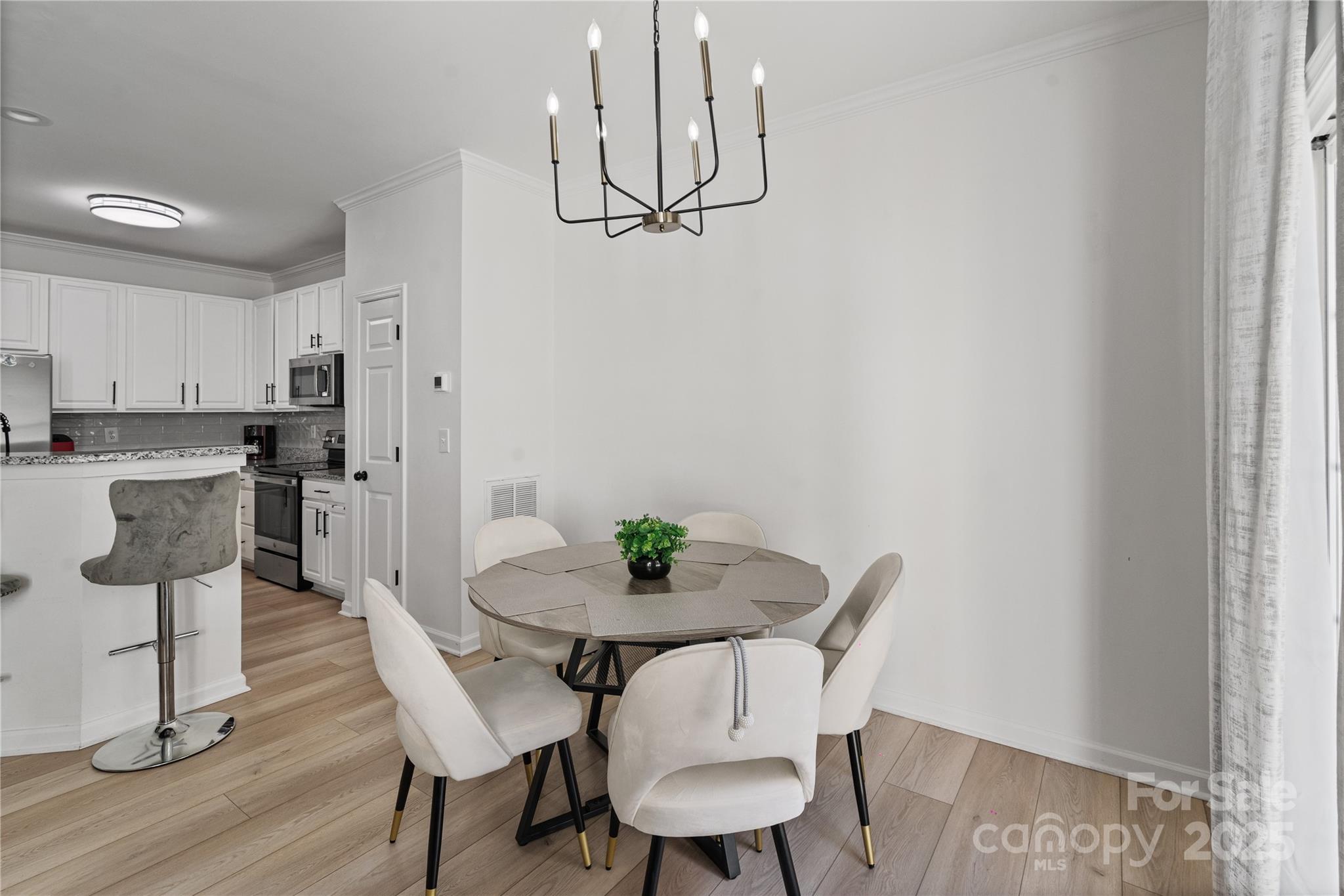 706 Shellstone Place Fort Mill, SC 29708 - Photo 15 of 23 a view of a dining room with furniture and wooden floor