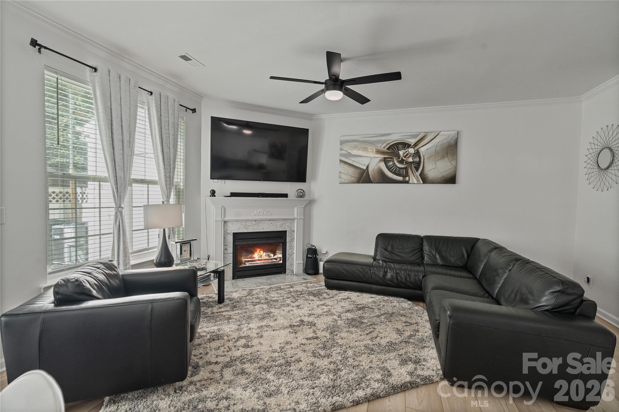 706 Shellstone Place Fort Mill, SC 29708 - Photo 17 of 23 a living room with furniture a flat screen tv and a fireplace