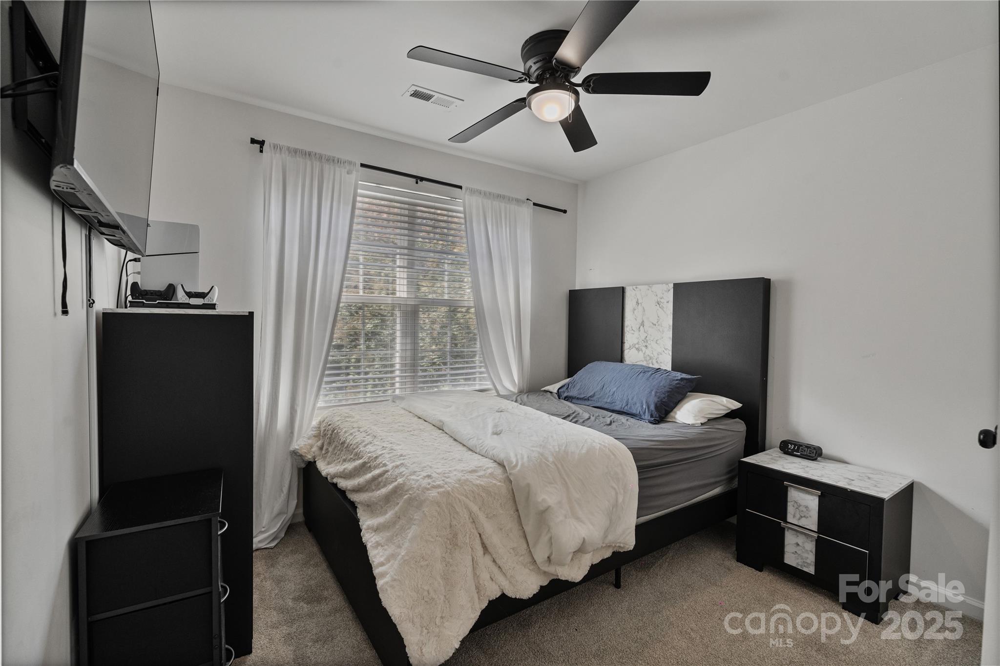 706 Shellstone Place Fort Mill, SC 29708 - Photo 18 of 23 a bedroom with a bed and a television