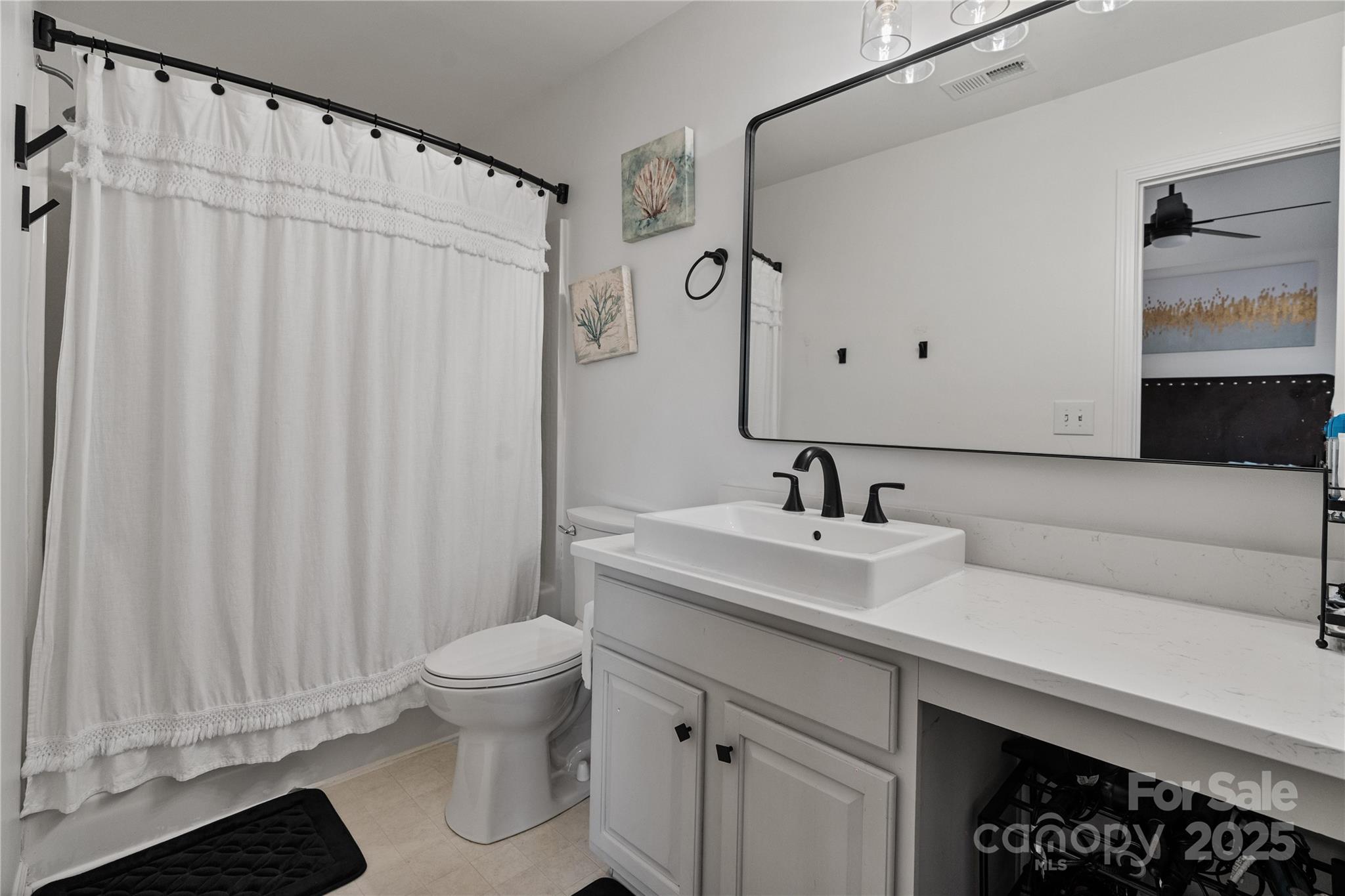706 Shellstone Place Fort Mill, SC 29708 - Photo 19 of 23 a bathroom with a sink a toilet and a mirror