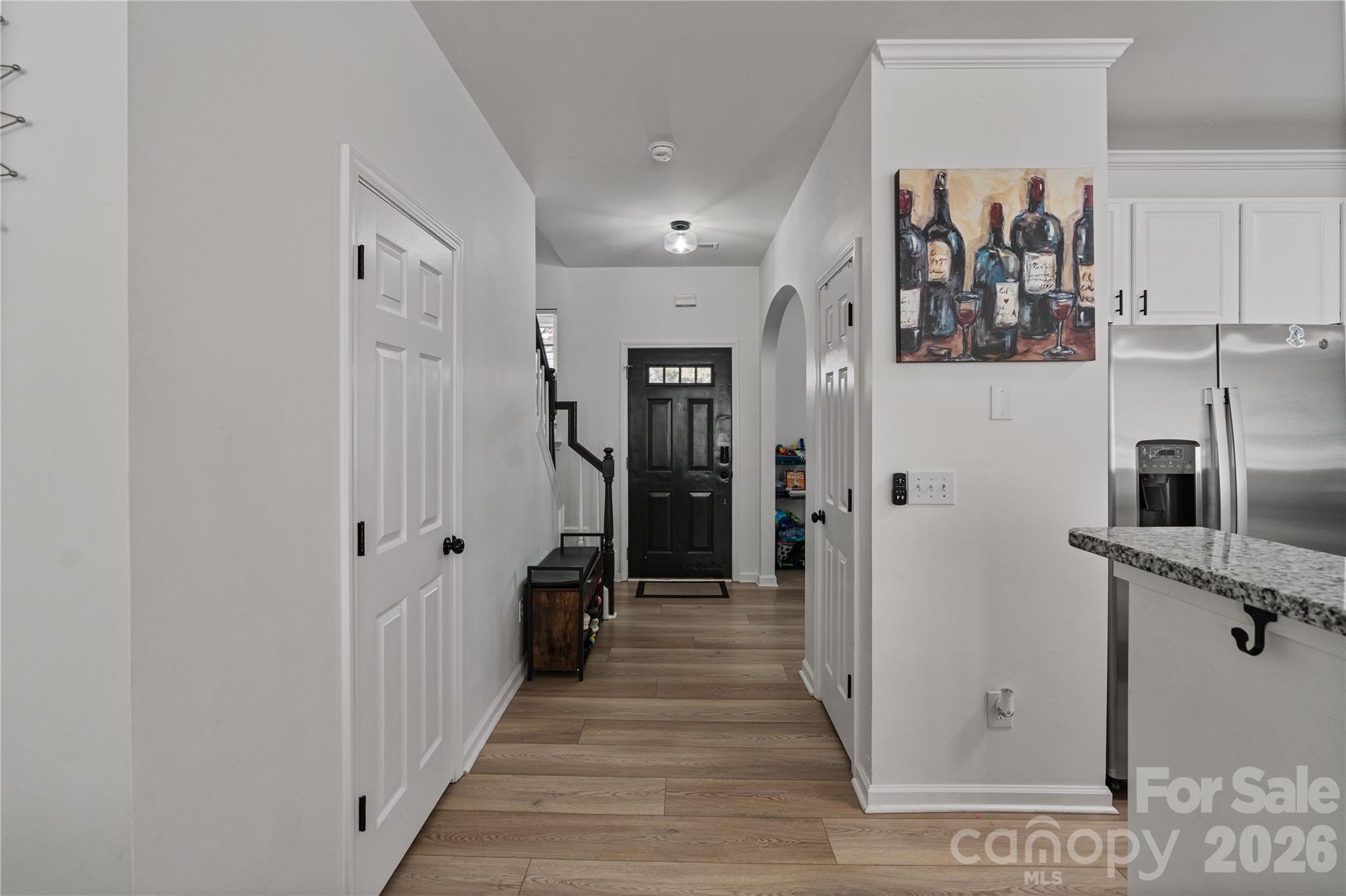 706 Shellstone Place Fort Mill, SC 29708 - Photo 8 of 23 a view of a hallway with wooden floor and staircase