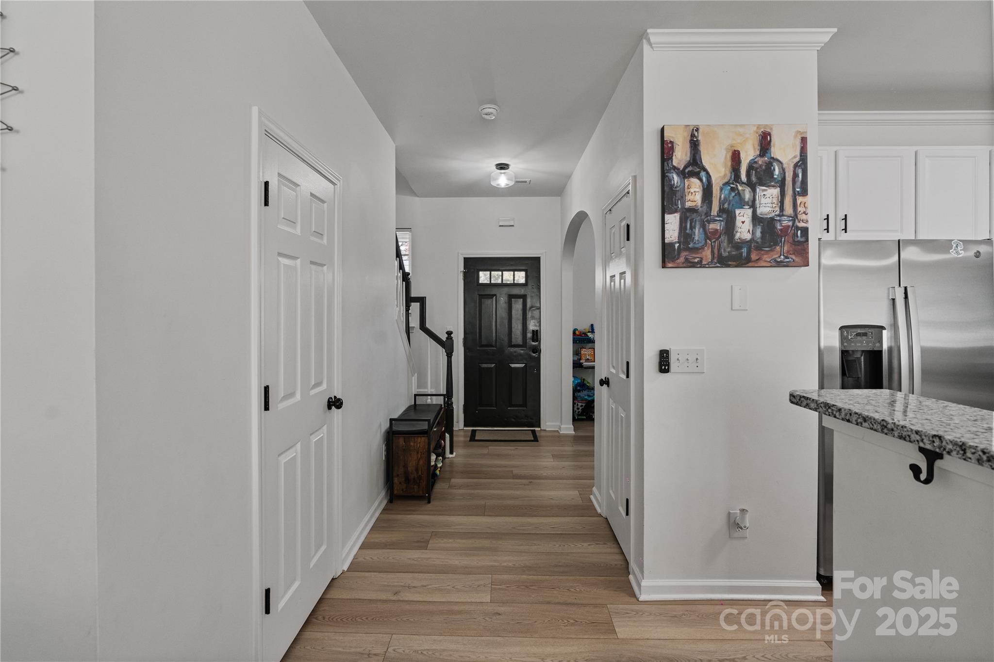 706 Shellstone Place Fort Mill, SC 29708 - Photo 8 of 23 a view of a hallway with wooden floor and staircase