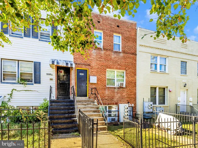 front view of a house with a fountain