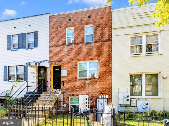 a front view of a building with glass windows