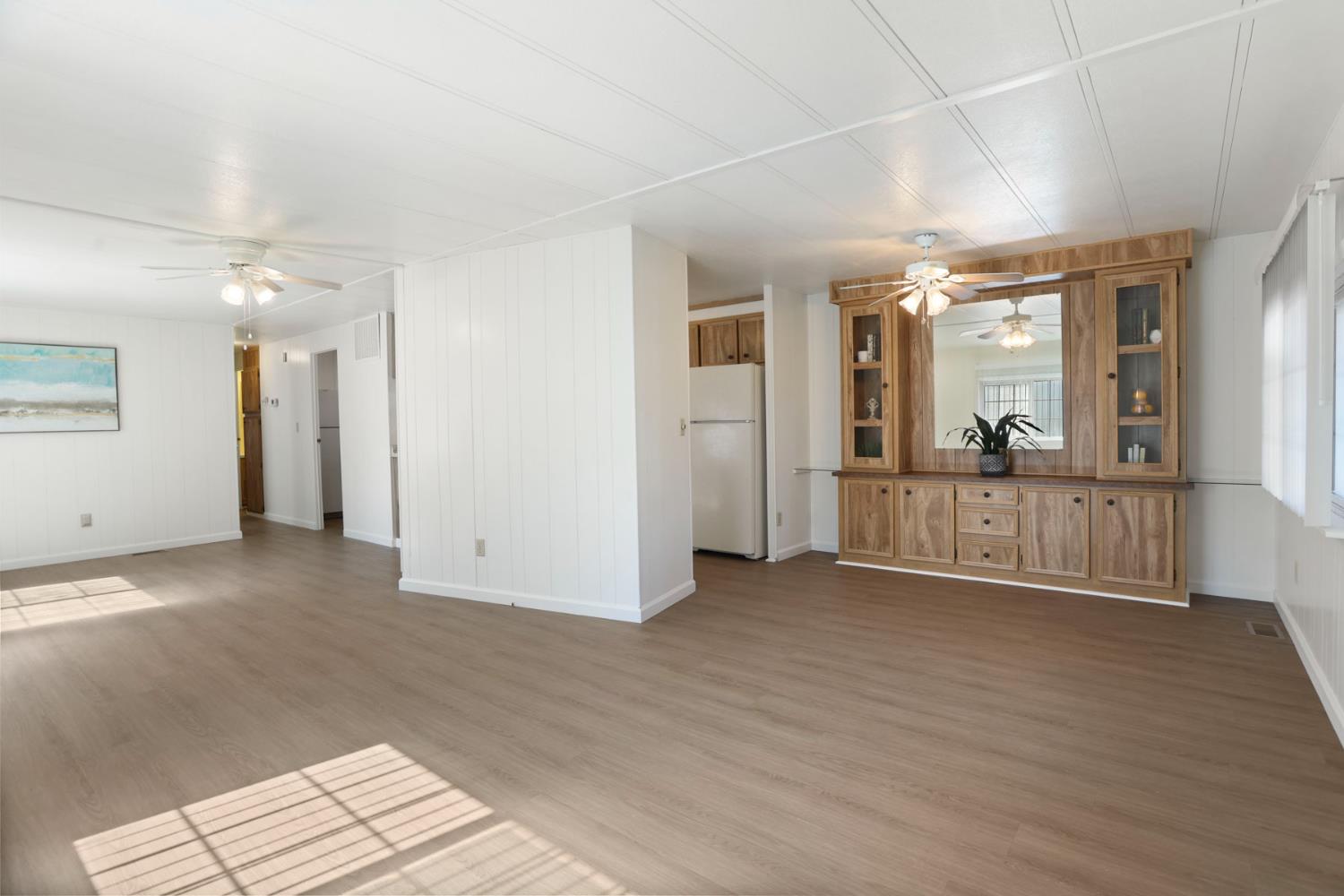 19 Rio Vista Drive Lodi, CA 95240 - Photo 12 of 34 a view of a big room with wooden floor and windows