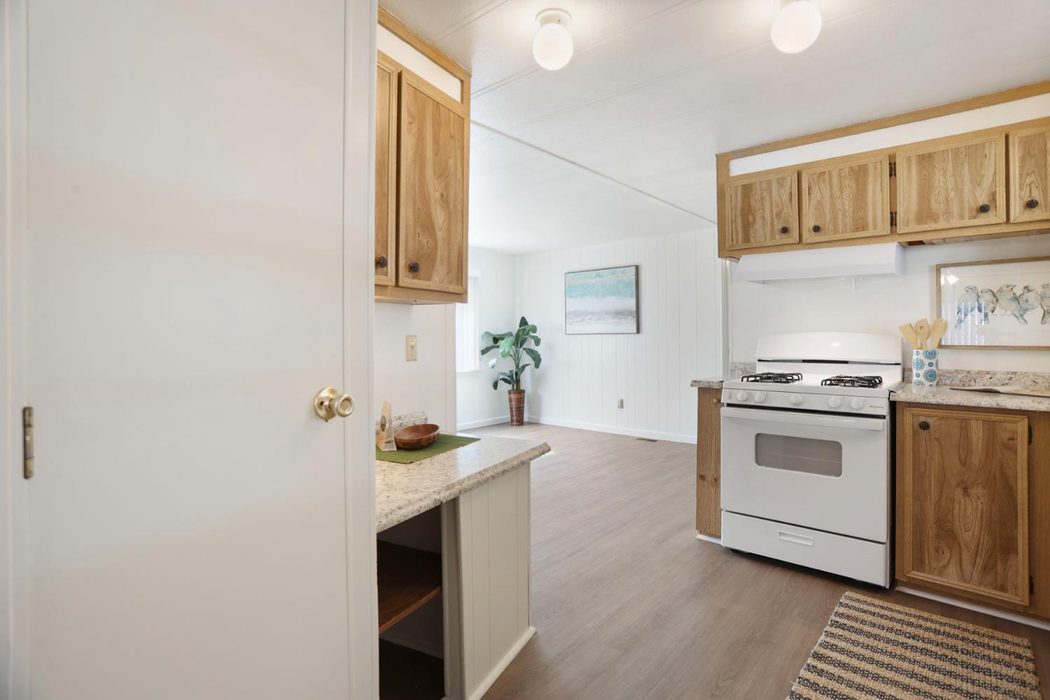 19 Rio Vista Drive Lodi, CA 95240 - Photo 18 of 34 a kitchen with stainless steel appliances a stove and a refrigerator