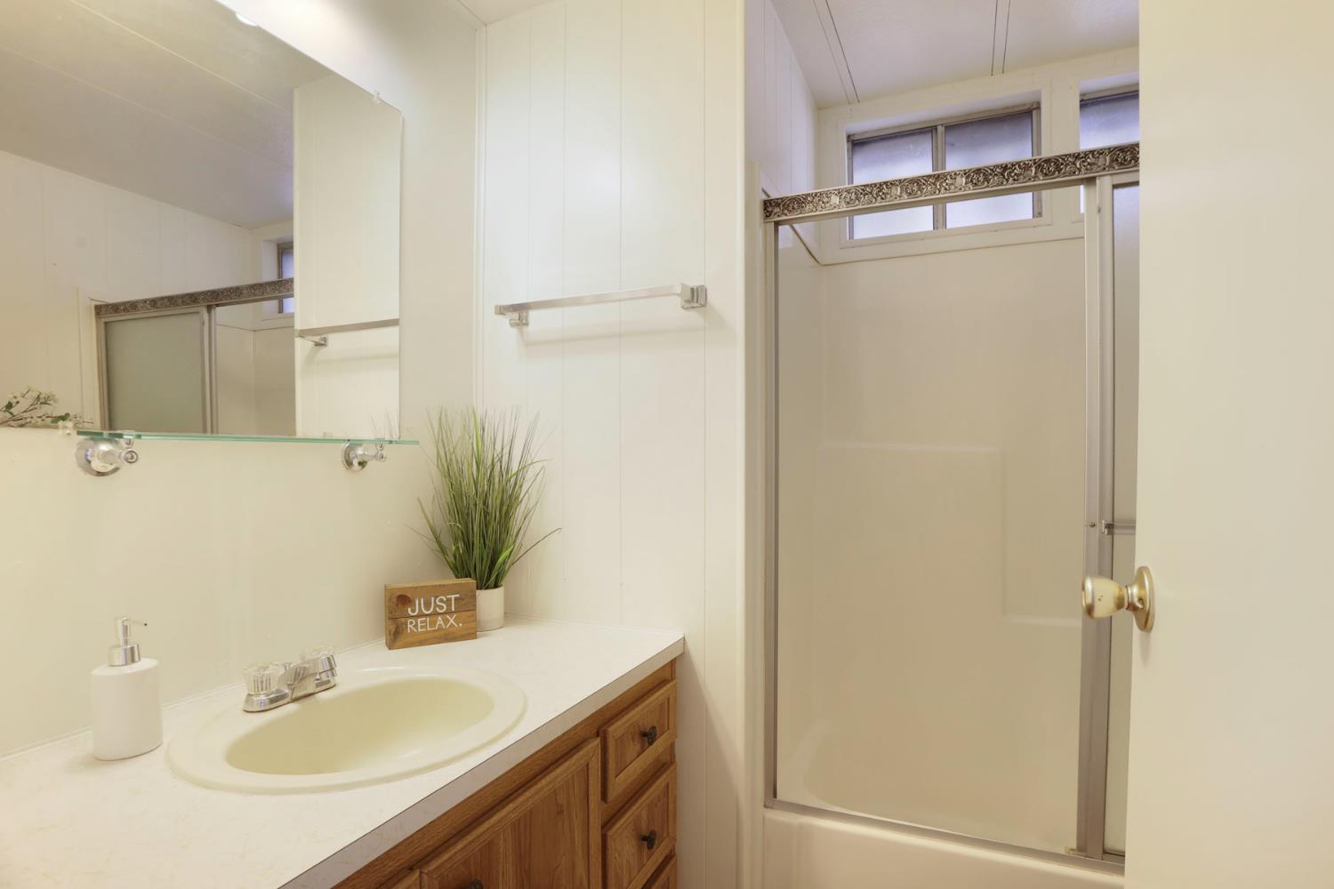 19 Rio Vista Drive Lodi, CA 95240 - Photo 26 of 34 a bathroom with a sink and mirror