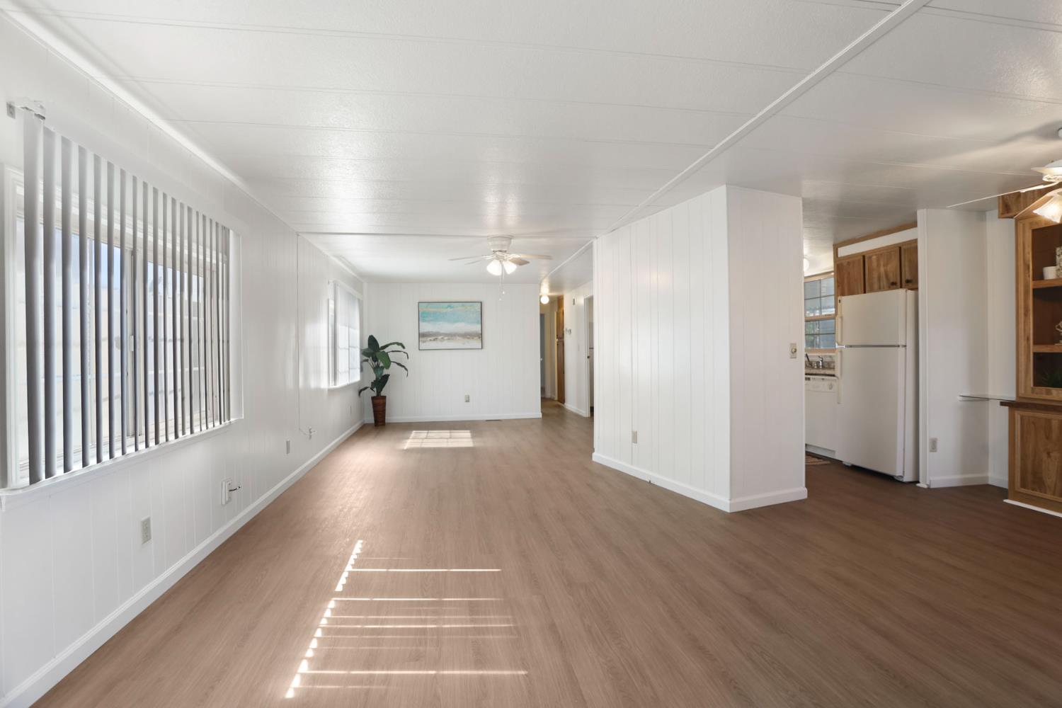 19 Rio Vista Drive Lodi, CA 95240 - Photo 10 of 34 a view of a hallway with wooden floor and windows