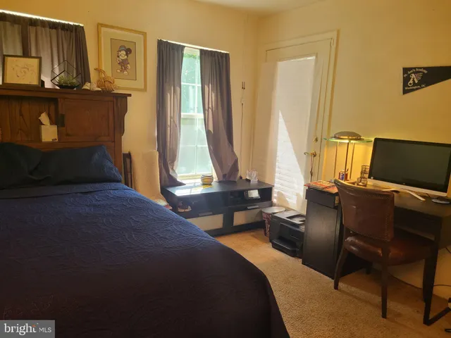 a view of a room with a table and chairs and couches chair