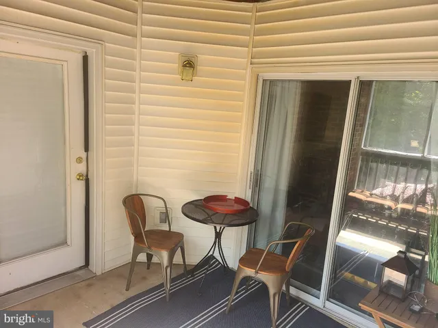 a living room with furniture flowerpot and a potted plant