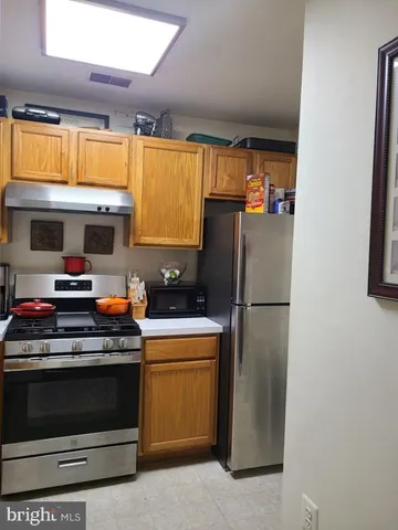 a kitchen with sink cabinets and window
