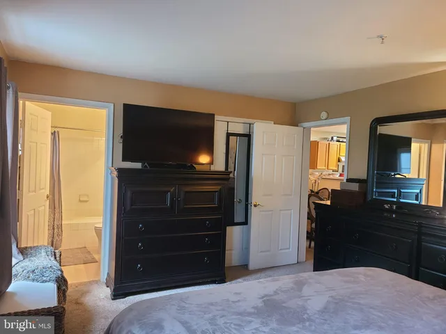a bedroom with a bed and furniture